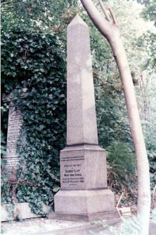 Stenobelisk i en have med en inskription til minde om Eliot