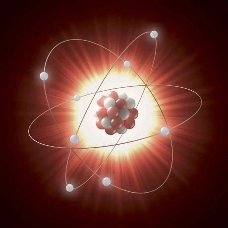 Illustration af en atomkerne som en række røde og hvide cirkler, der kredses af elektroner repræsenteret af hvide cirkler.