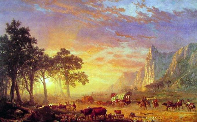 Maleri af nybyggere på Oregon Trail gå mod en smuk solnedgang.